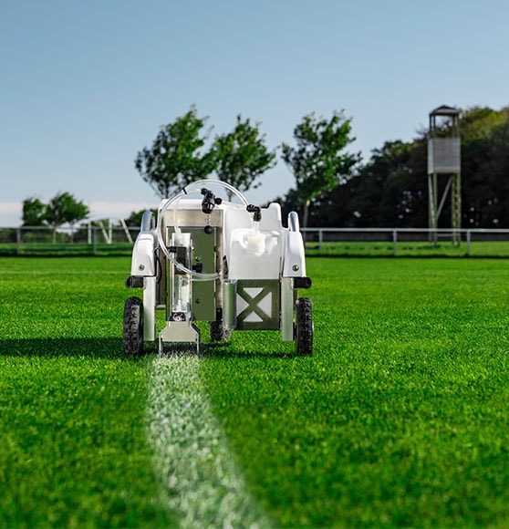 tiny line marking robot on grass field