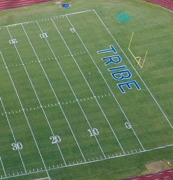 aerial view of football field after end zone marking painted