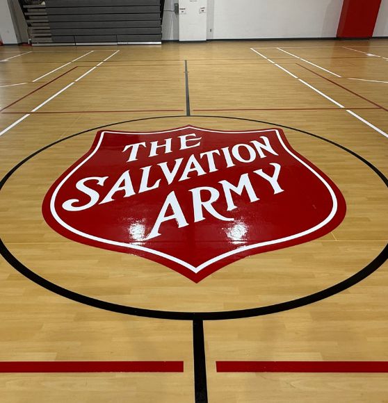 Salvation Army logo on gym court freshly painted