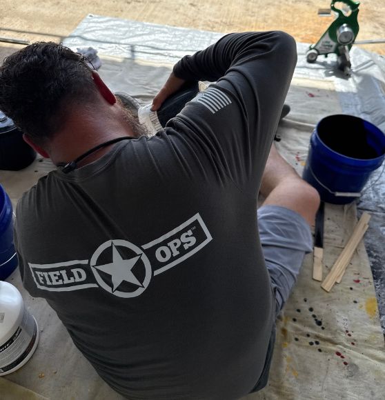 FIELD OPS® employee installing new line markings for St. Augustine University pickleball court