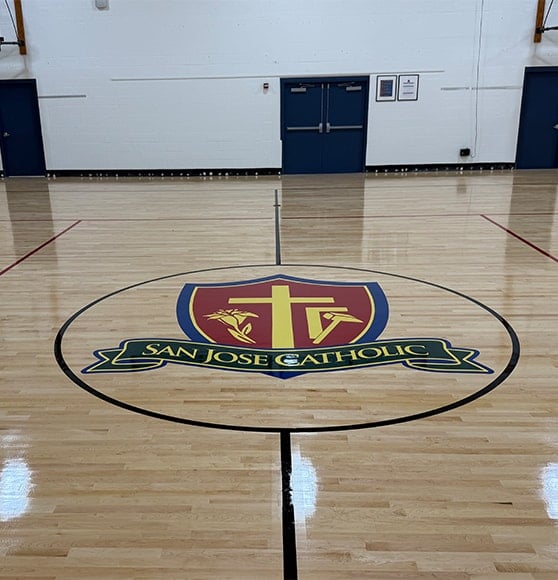 front view of San Jose Catholic School basketball court freshly painted