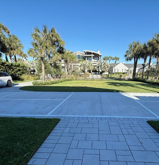 front view of Private Residence with a freshly painted pickleball court