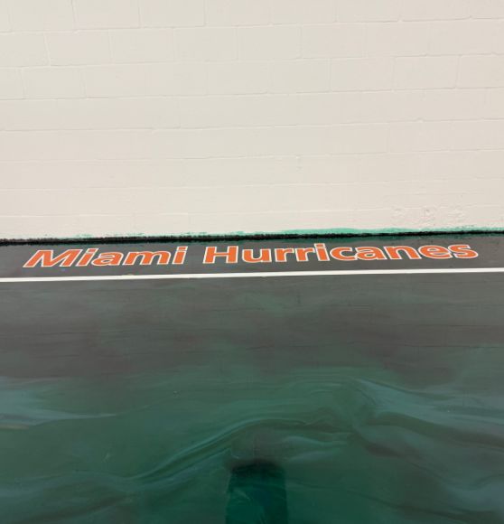 "Miami Hurricanes" painted on residential indoor basketball court