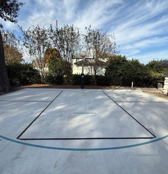 front view of pickleball and basketball court freshly painted for resident