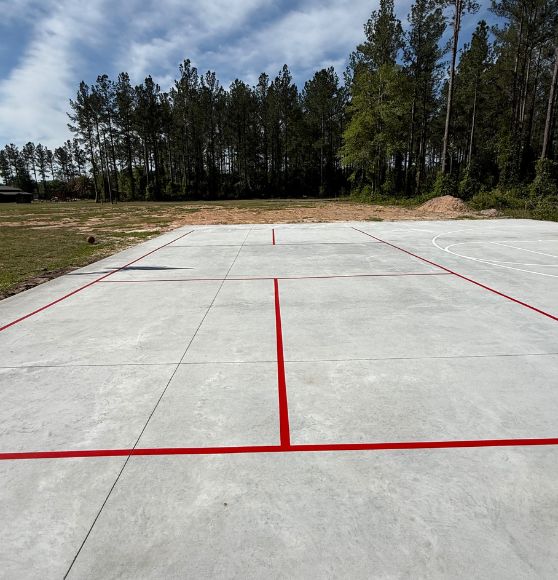 red line markings painted on private homeowner basketball court