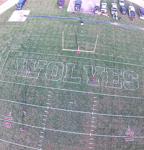 aerial view of Lebo High School football field getting new line markings