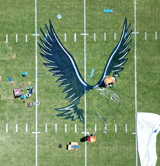 aerial view of freshly painted logo on football field
