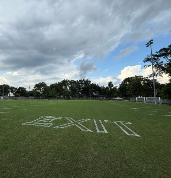 "exit" freshly painted on Concordia Lutheran High School soccer field