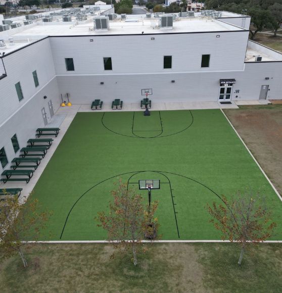Great Hearts Invictus basketball court freshly painted aerial view