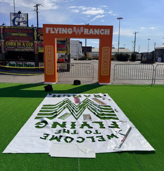 Stock Show and Rodeo Flying W Ranch with logo stencils on field