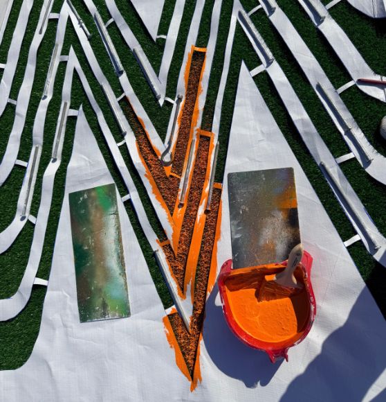 close-up of event logo stencil on Stock Show and Rodeo Flying W Ranch field