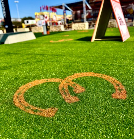 close-up of event logos freshly painted for Stock Show and Rodeo Flying W Ranch