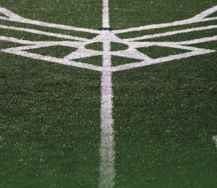 event logos striped on athletic field