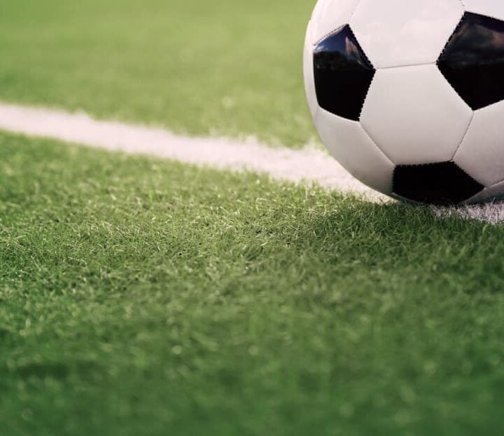striped soccer field with soccer ball