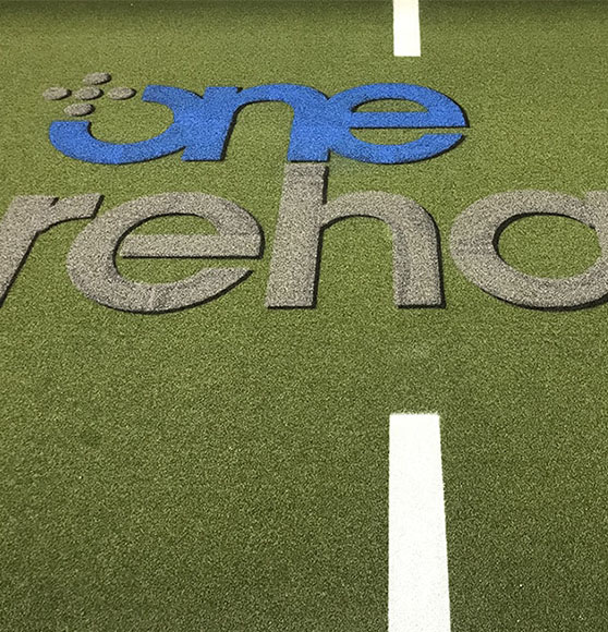 one rehab stencils on football field