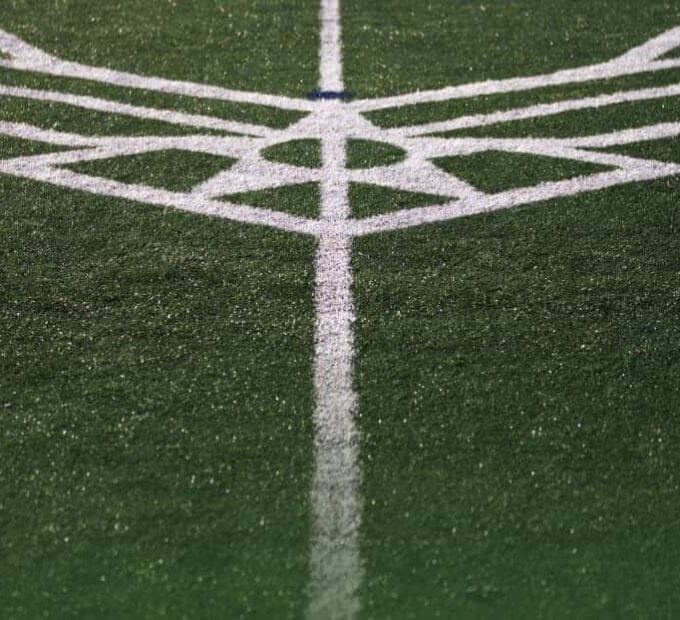 event logos striped on athletic field