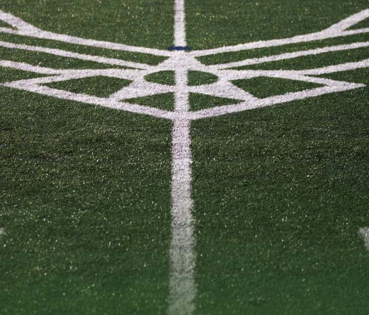 event logos striped on athletic field