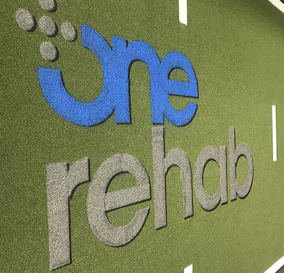 one rehab stencil on new football field
