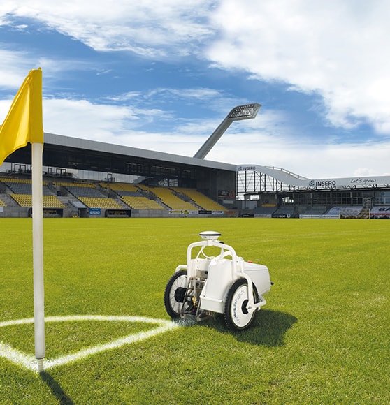 tiny robot on soccer field