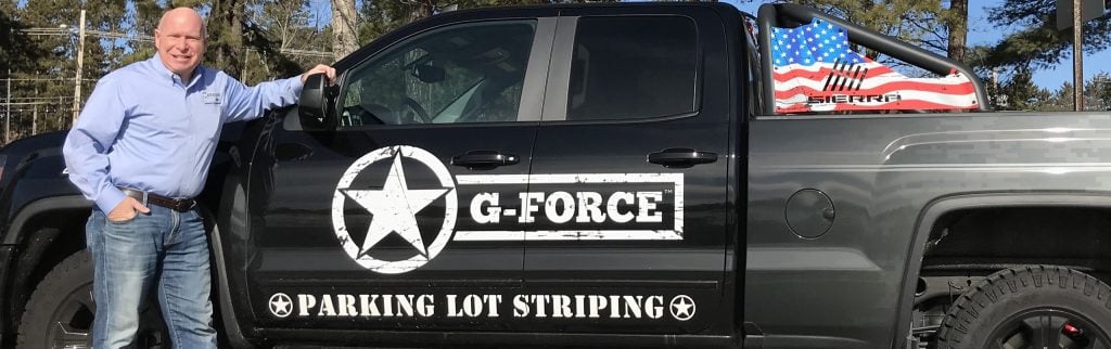 g-force founder jack child standing in front of truck